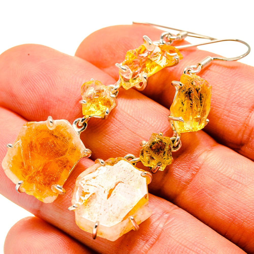 Rough citrine drop earrings with silver prong settings, amber-yellow stones