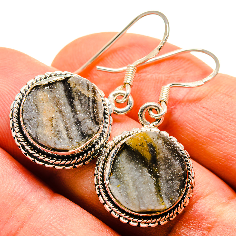 Oval druzy stone drop earrings with rope border, silver-tone hook wires and mottled gray and gold