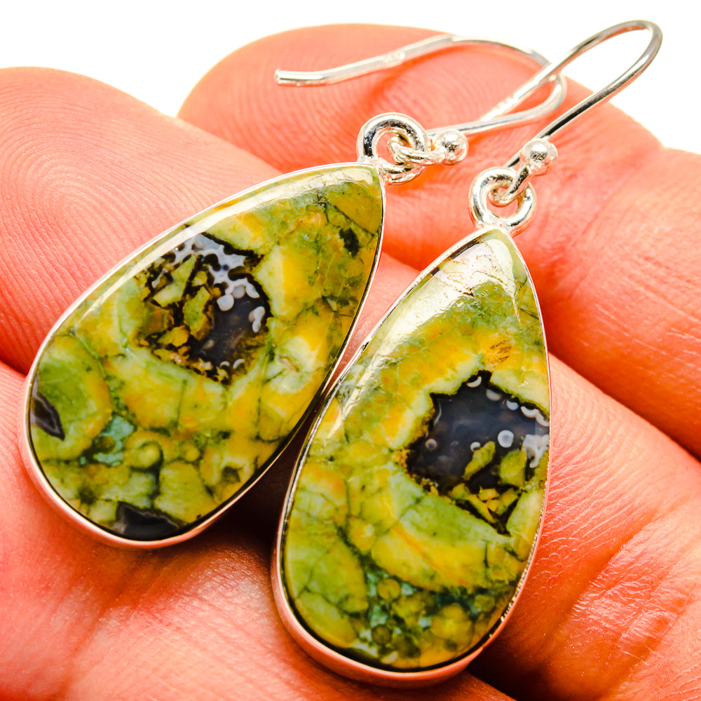 Teardrop opal earrings in green with silver hooks and pear-cut pattern