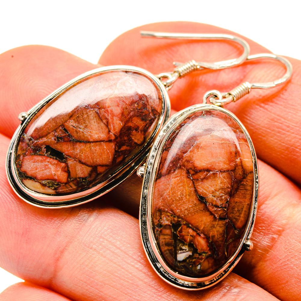 Oval orange-brown jasper drop earrings in silver with textured loop hooks
