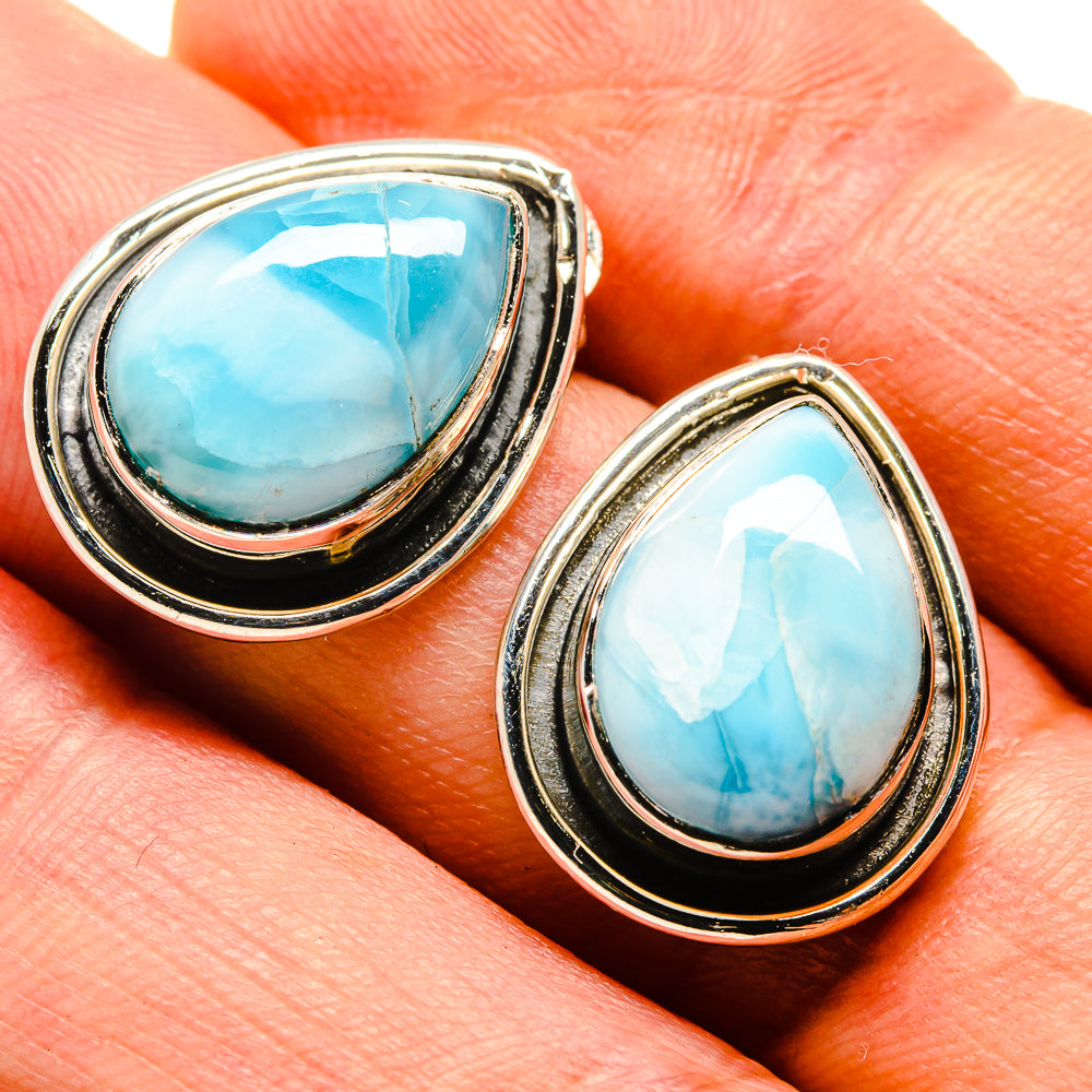 Teardrop larimar cabochon earrings with blue oval stones and silver-toned frames