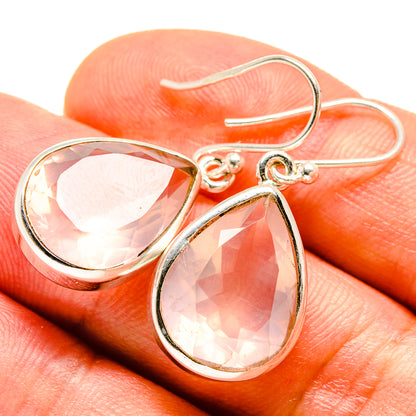 Rose quartz drop earrings with faceted pink teardrop stones, silver lever hooks
