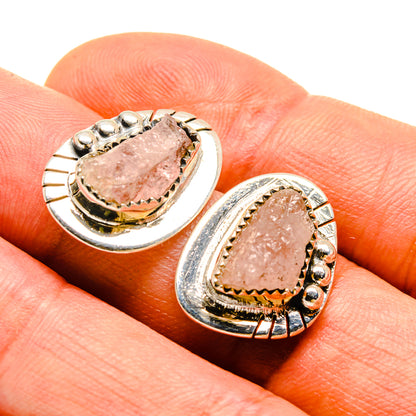 Rough rose quartz stud earrings with sterling silver oval bezel and textured frame
