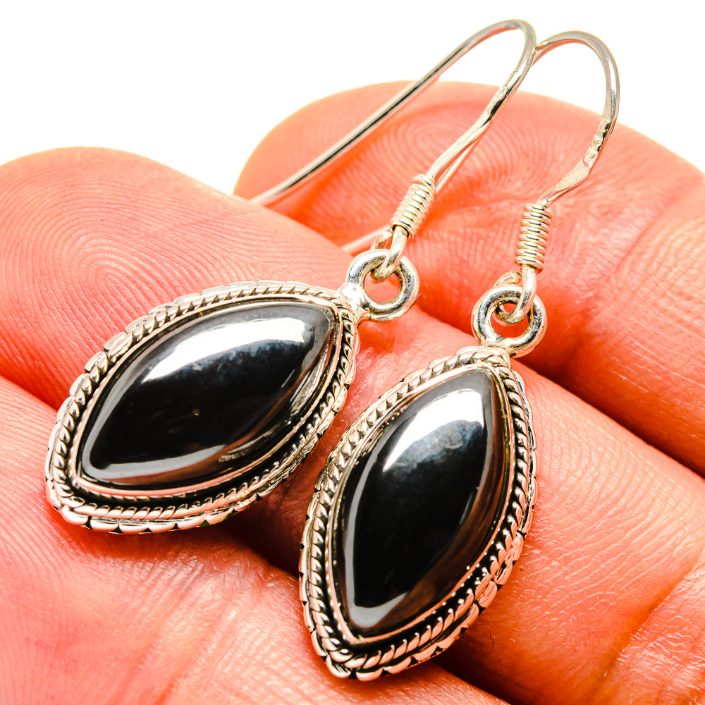 Hematite oval drop earrings with textured silver edge and round wire hooks