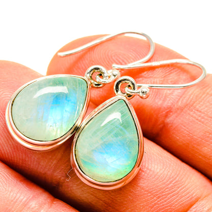 Teardrop moonstone earrings with green-blue iridescent stones, silver-tone hooks