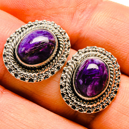 Sterling silver charoite earrings showing purple oval cabochon with engraved frame