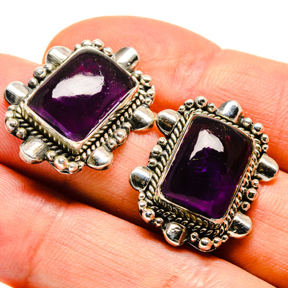Square amethyst stud earrings, ornate silver-tone bezel setting with purple gemstone