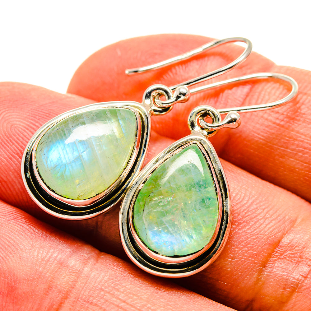 Sterling silver teardrop moonstone earrings with green opalescent stones, curved hooks