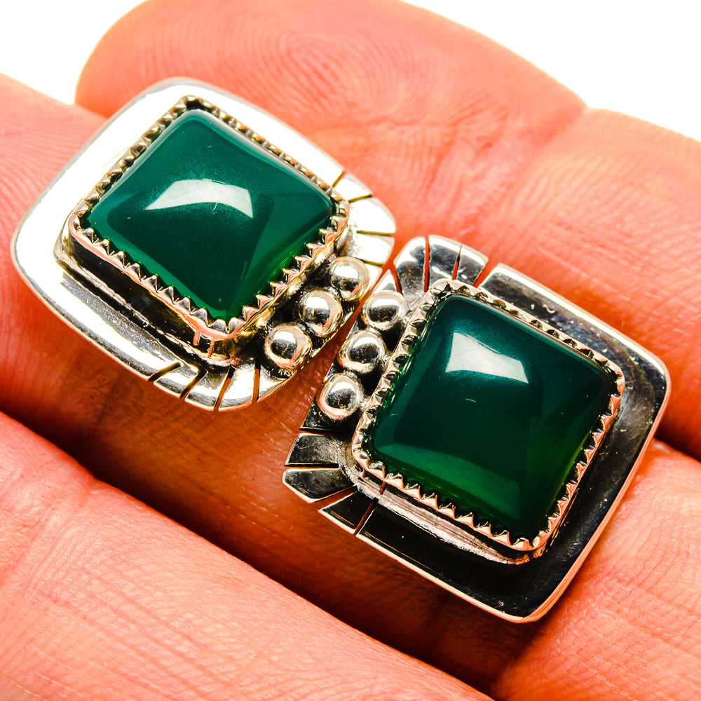 Square green onyx stud earrings with detailed silver bezel, dark border, gold-tone posts