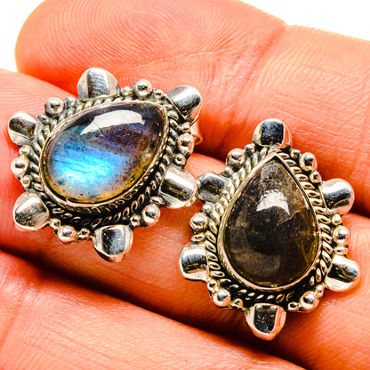 Labradorite drop earrings in silver tone with oval blue flash gemstone and bezel setting