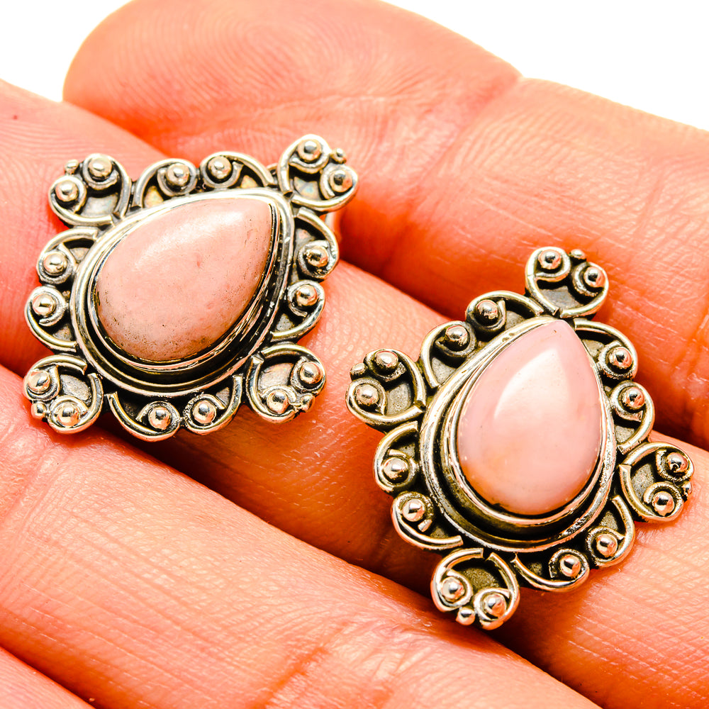 Pink opal teardrop earrings close-up with gold-tone filigree scalloped frame