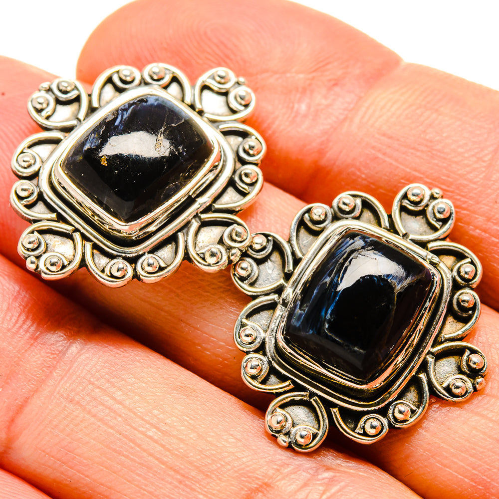 Square pietersite stud earrings with swirling filigree and dark blue cabochon