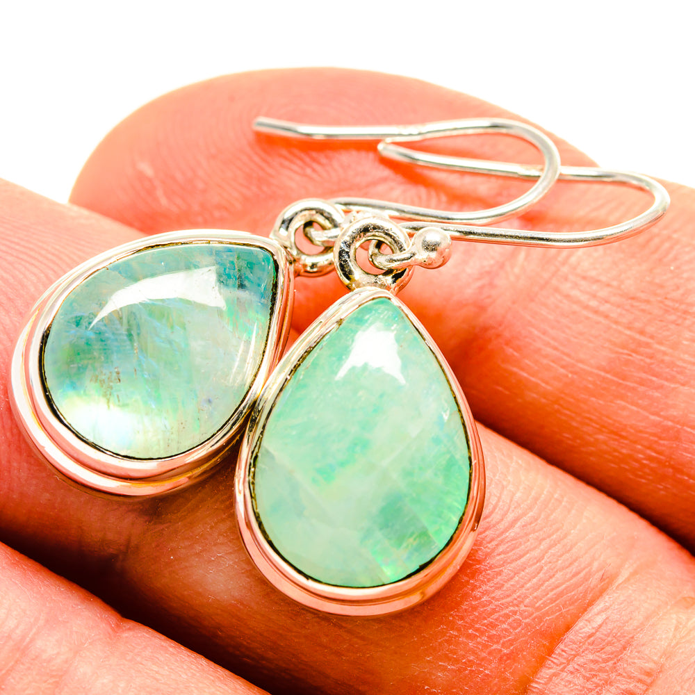 Sterling silver earrings with green teardrop opal stones and fishhook backs