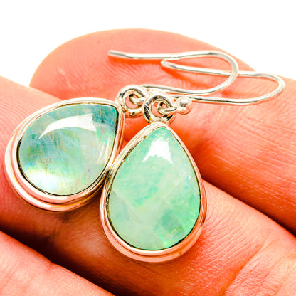 Sterling silver earrings with green teardrop opal stones and fishhook backs