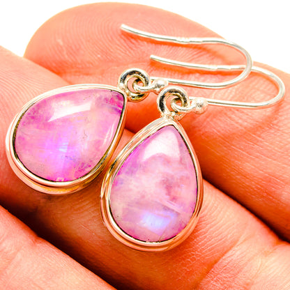 Pink moonstone teardrop earrings, silver-tone frame with gold-tone hooks