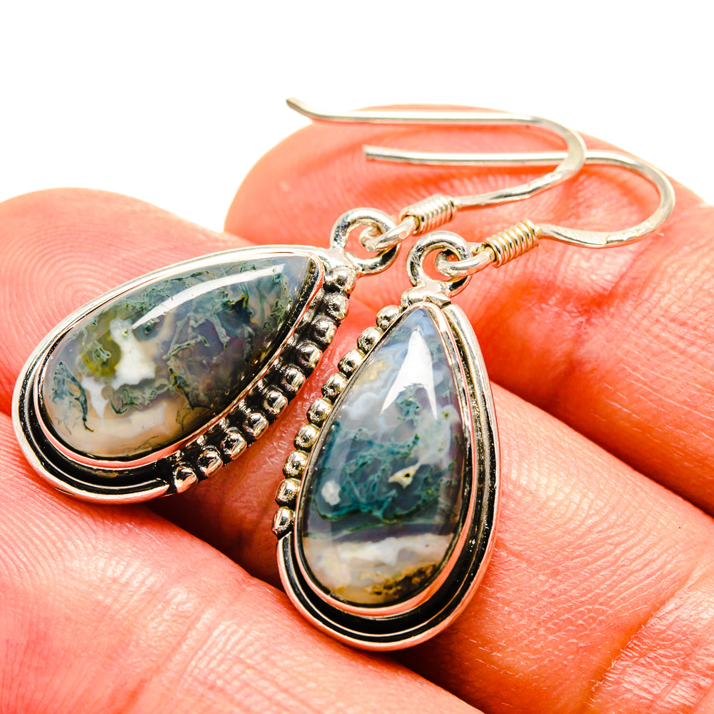 Teardrop moss agate earrings, close view of green-and-yellow stones, silver hooks