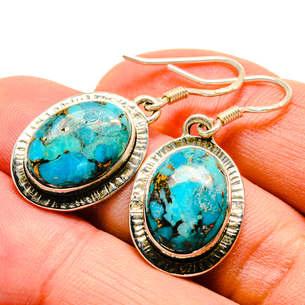 925 sterling silver turquoise oval drop earrings close-up with textured bezel and hook