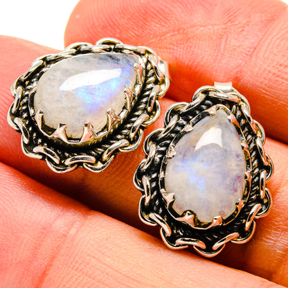 Close-set oval moonstone stud earrings with rainbow flash, gold-tone rope silver setting