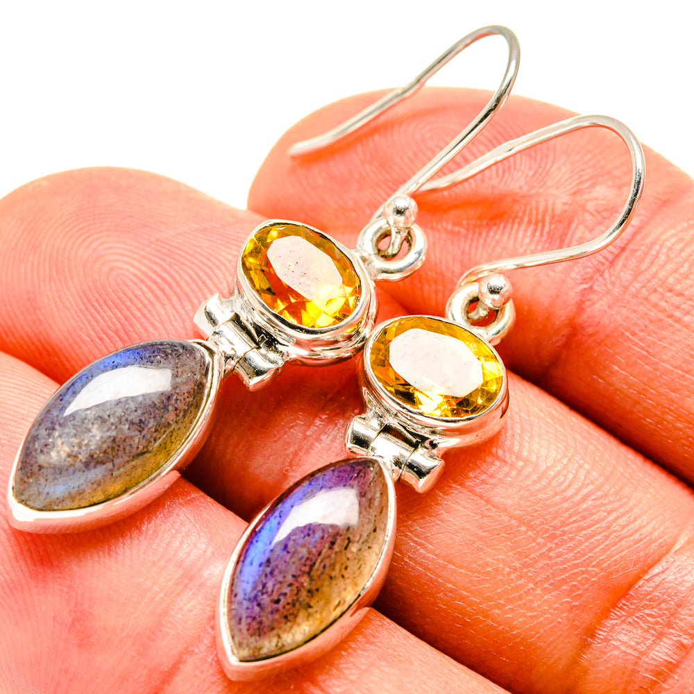 Sterling silver drop earrings with yellow round stones and purple-blue teardrop stones