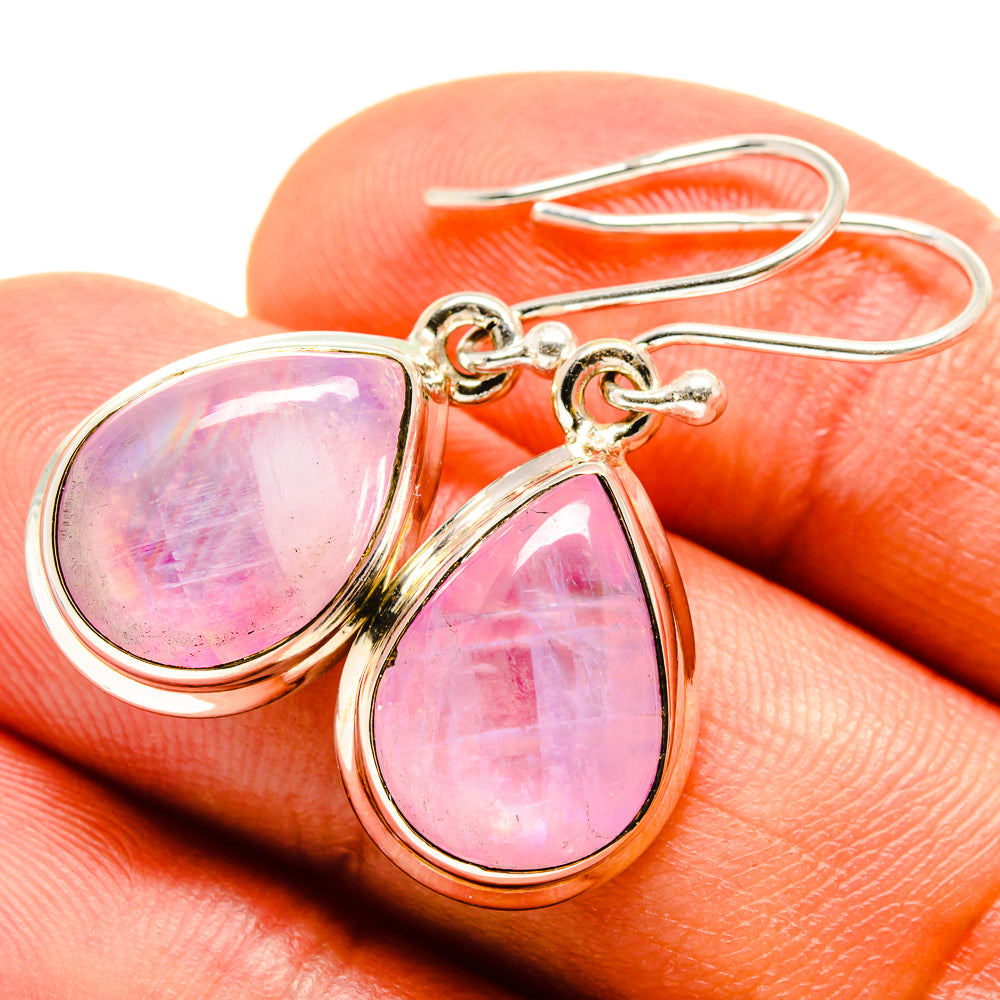 Pink teardrop moonstone drop earrings on metal hooks, gold-tone bezel