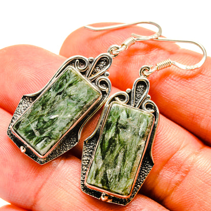 Seraphinite drop earrings with rectangular green marbled stones and silver hook backs