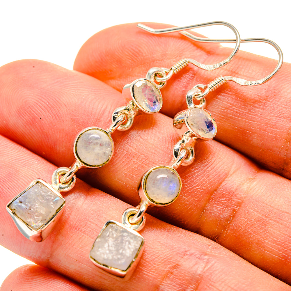 Dangling earrings with rough opalescent moonstone and gold-tone oval and square charms
