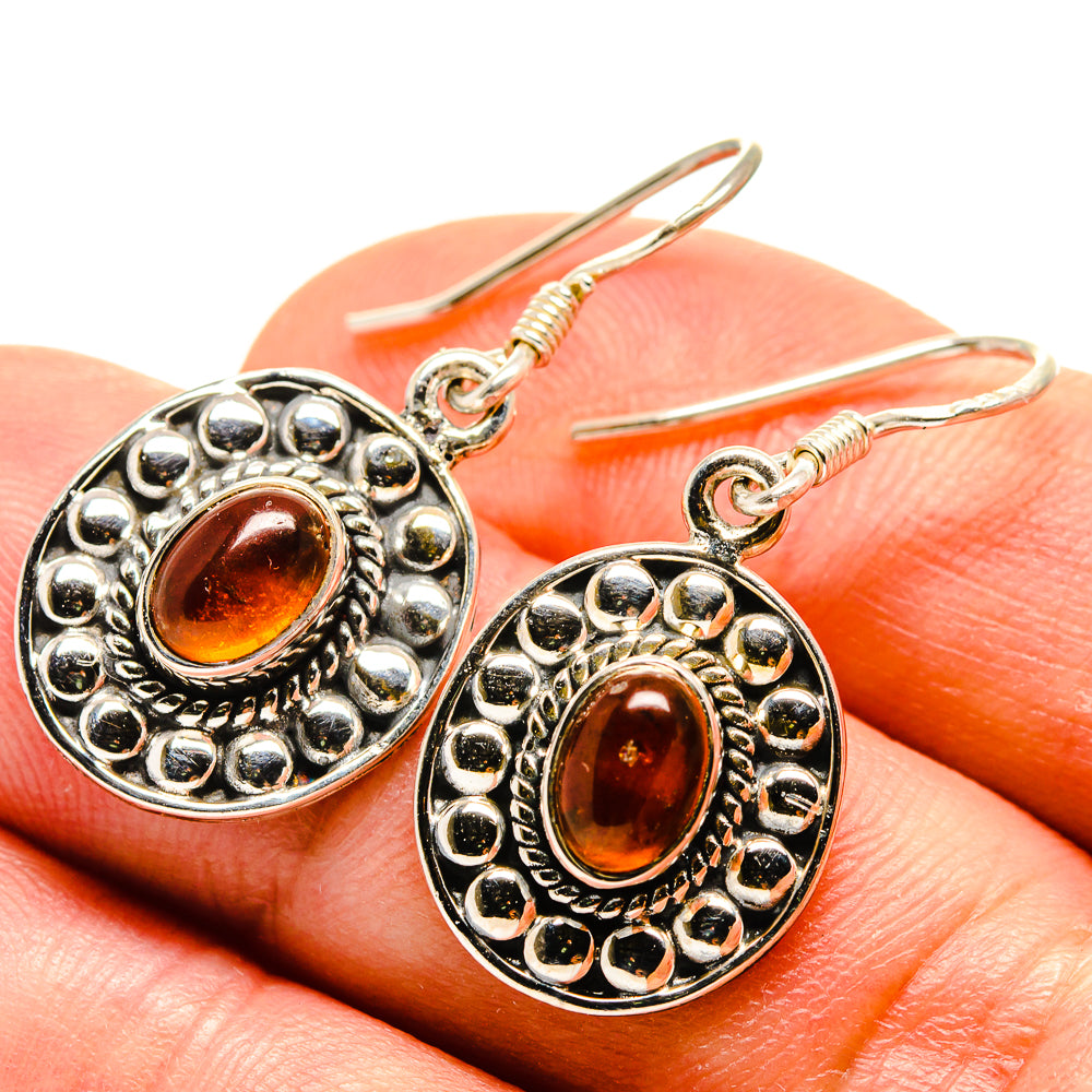 Carnelian cabochon drop earrings, round filigree border, orange stone in silver setting