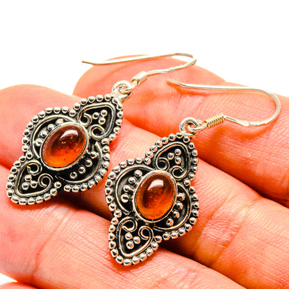 Orange carnelian heart drop earrings with silver-tone beaded filigree and fishhook backs