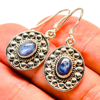 Kyanite drop earrings, oval blue stone in ornate silver setting with hook backs