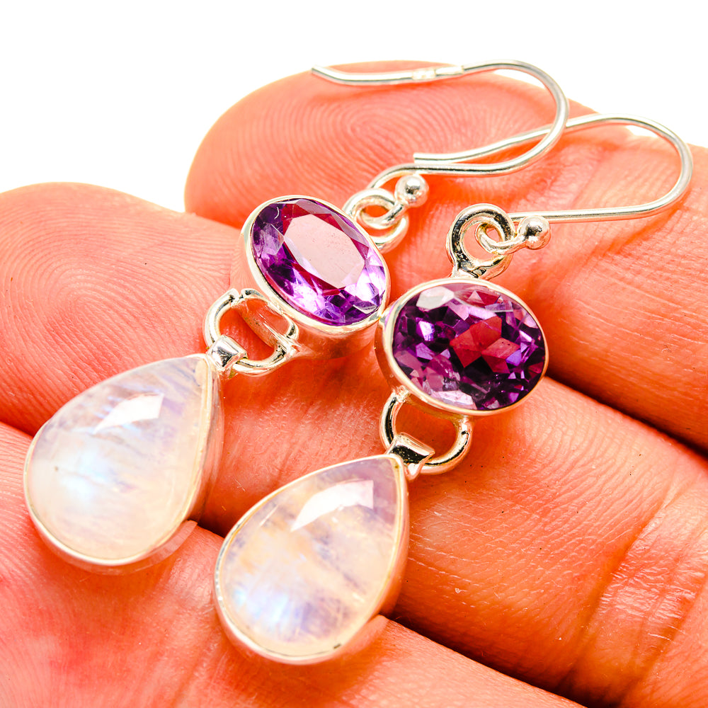 Amethyst and opal-tone drop earrings with purple stones and teardrop pendants