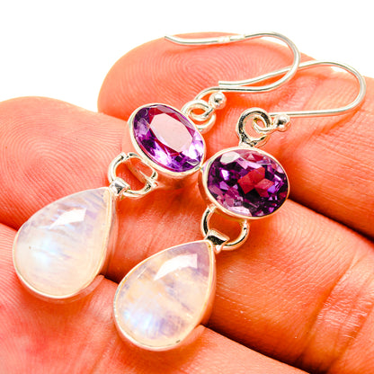 Amethyst and opal-tone drop earrings with purple stones and teardrop pendants