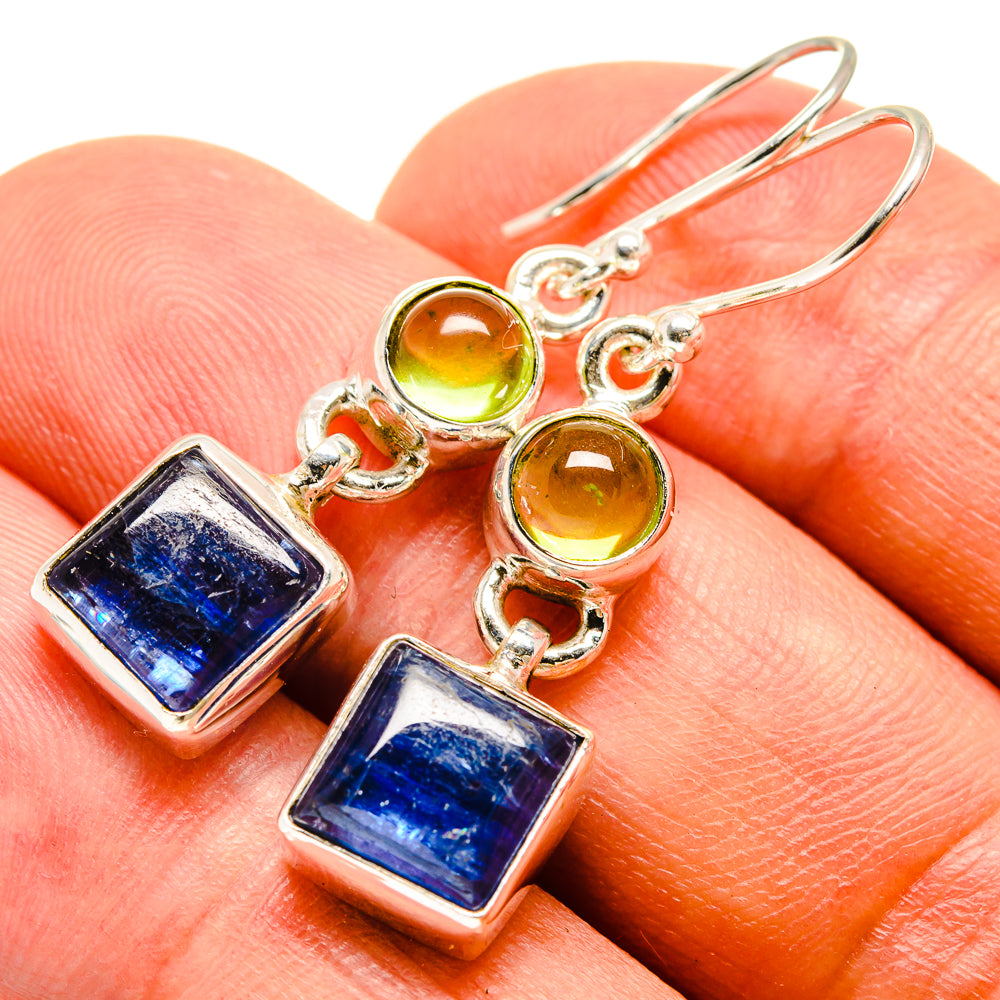 Sterling silver drop earrings with blue square stones and green round beads on hooks
