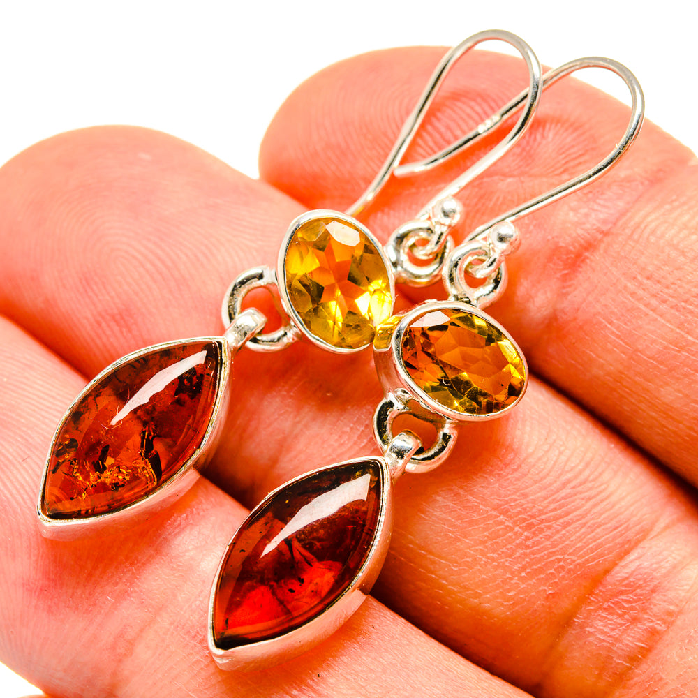 Sterling silver dangle earrings with round yellow and amber teardrop gemstones