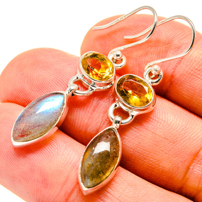 Sterling silver dangle earrings with round golden citrine and oval iridescent stones