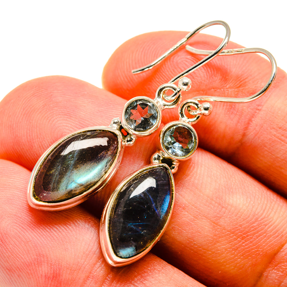Sterling silver drop earrings with oval labradorite and round blue topaz stones