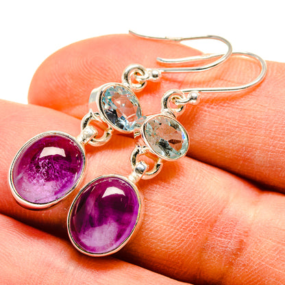 Sterling silver drop earrings with oval blue topaz and amethyst stones, lever hooks