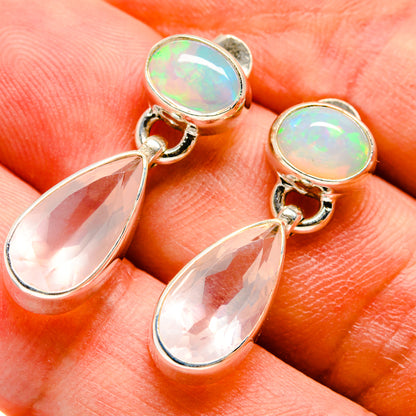 Sterling silver earrings with iridescent round opal cabochons and pink teardrop dangles