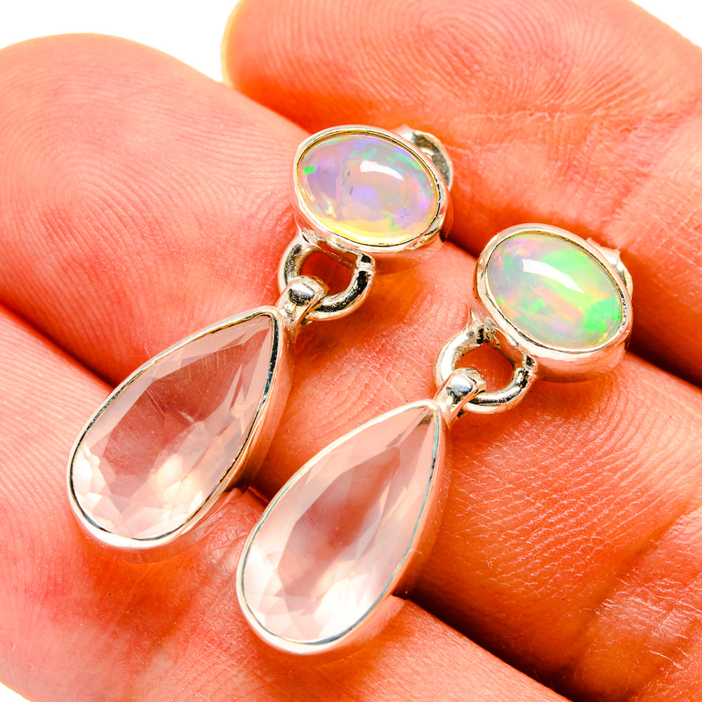 Rose quartz and opal drop earrings with gold-tone frames and teardrop pink stones