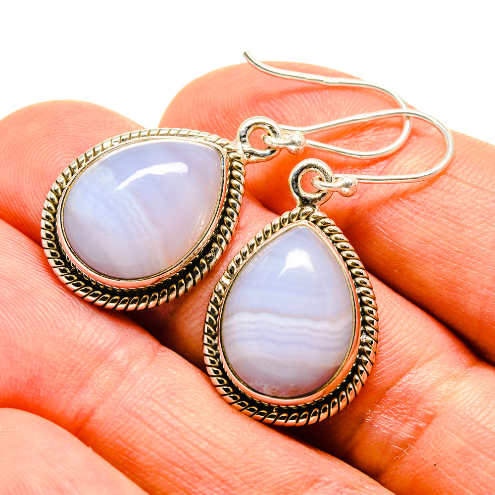 Teardrop blue lace agate earrings, beaded silver-tone border and hook close-up
