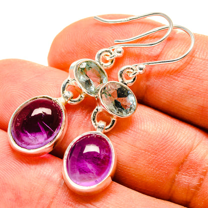 Sterling silver drop earrings with round purple amethyst and oval light blue stones