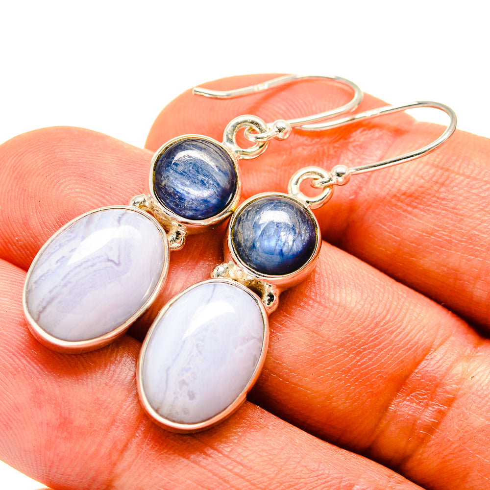 Blue and pale oval drop earrings in gold-tone settings with wire hooks