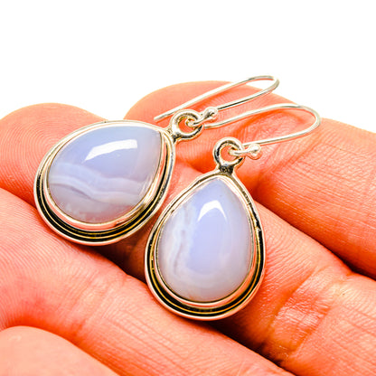 Teardrop opal-style earrings with gold-tone bezel, fishhook backs