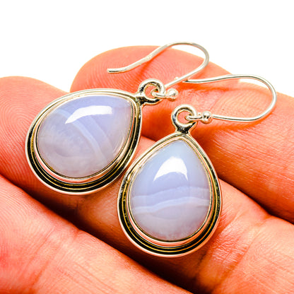 Sterling silver teardrop earrings with blue lace agate, close-up on hooks