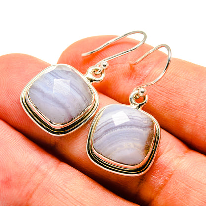 Sterling silver drop earrings with blue lace agate cabochon, gold-tone wire hooks