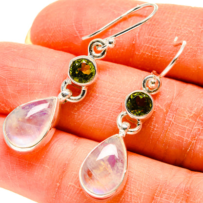Sterling silver earrings with peridot green round stones and iridescent moonstone teardrops
