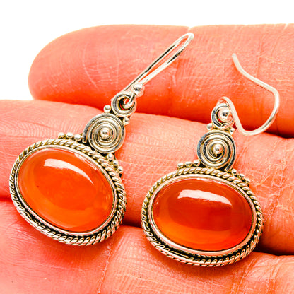 925 sterling silver carnelian hoop-style drop earrings with orange round cabochons, hooks