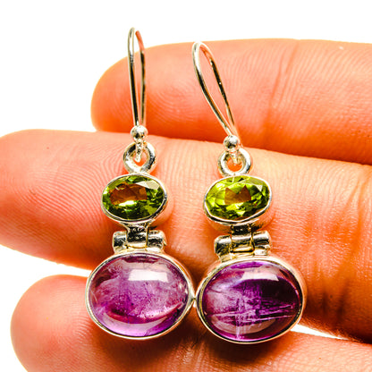 Amethyst and peridot drop earrings, oval purple cabochons and green stones on silver hooks