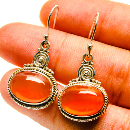 Sterling silver carnelian drop earrings, oval orange stones in ornate frame