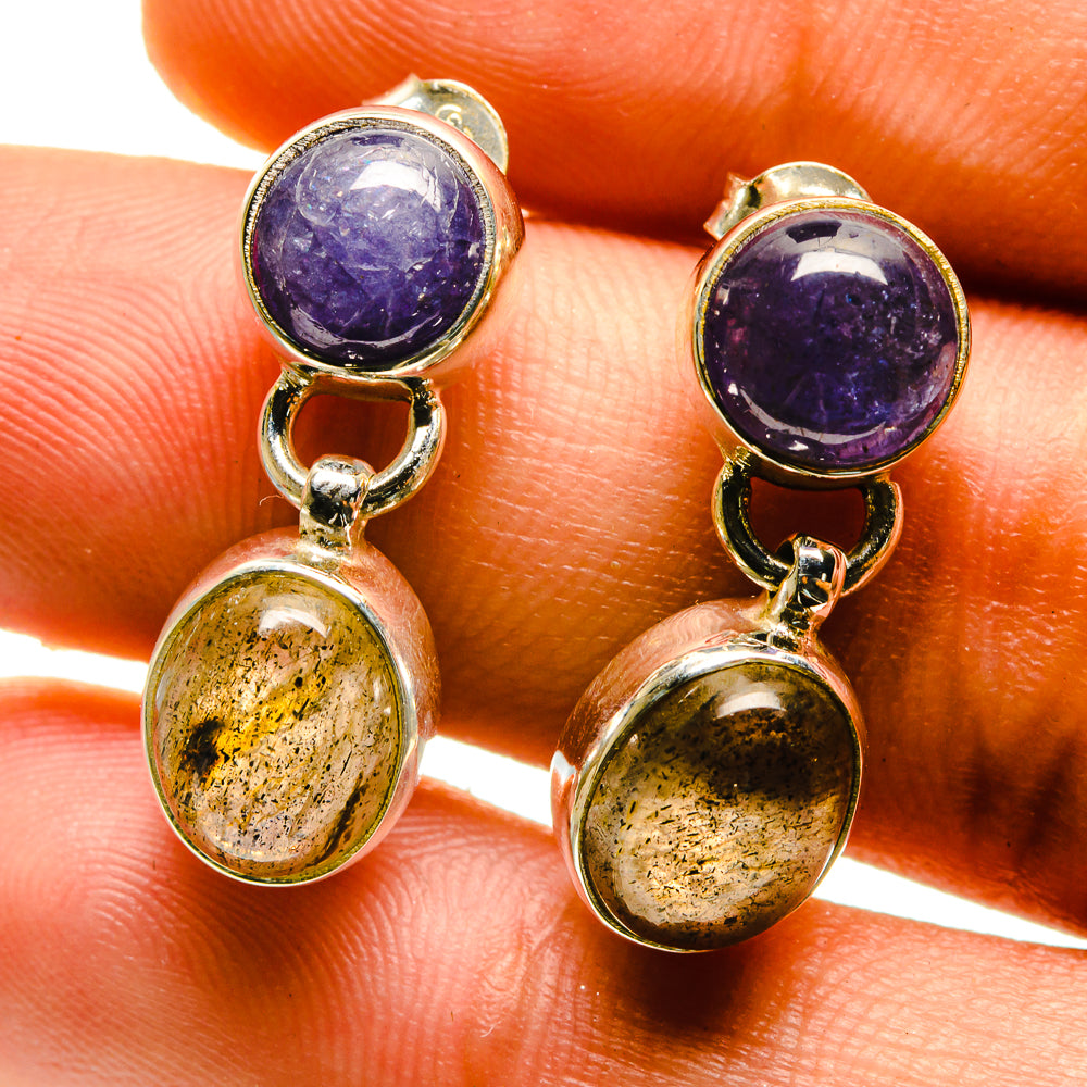 Close-up drop earrings with dark purple round stone and oval gold-speckled stone