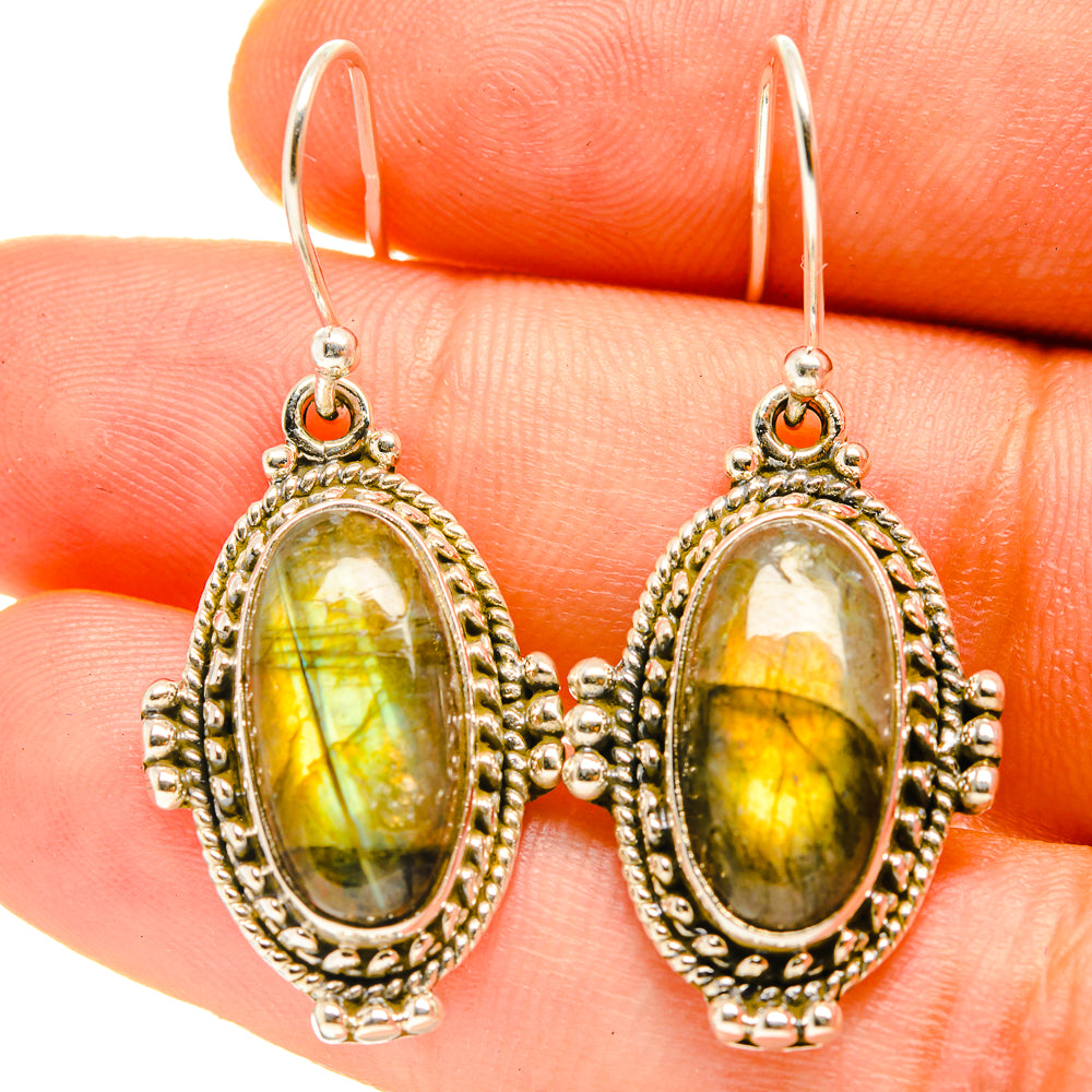Oval labradorite drop earrings with yellow-green stone and silver filigree settings